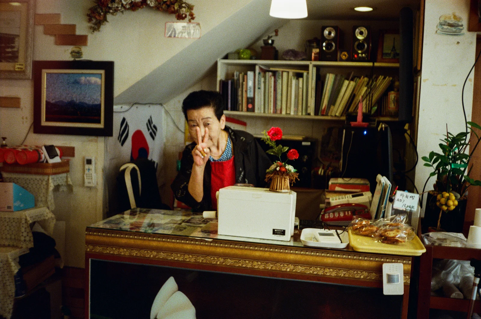 Baker taking a break outside her shop